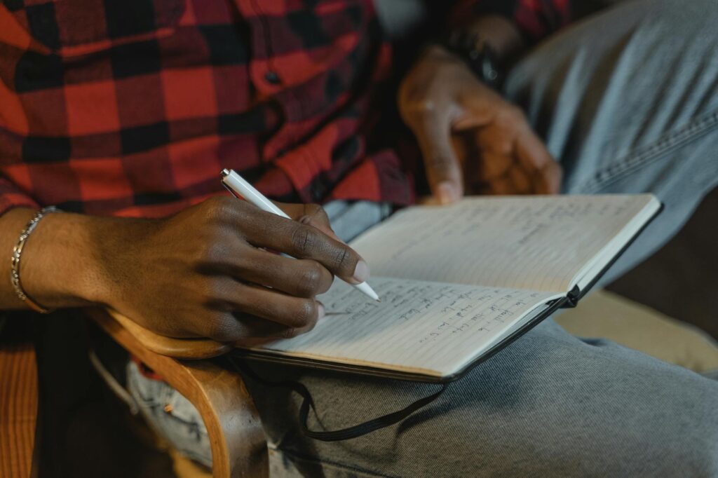 A close-up of a journal and pen, symbolizing self-reflection and emotional processing. — coping strategies grandparents …