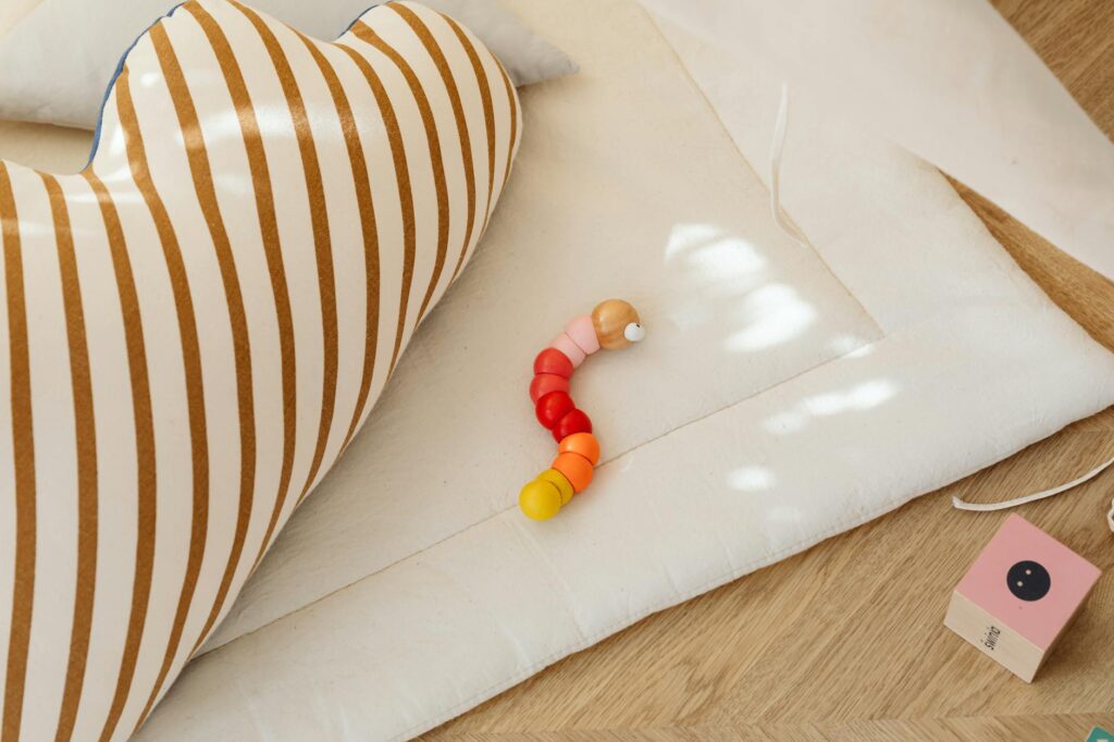 A cozy corner with cushions and toys, creating a safe space for children. — safe space grandchildren feelings divorce