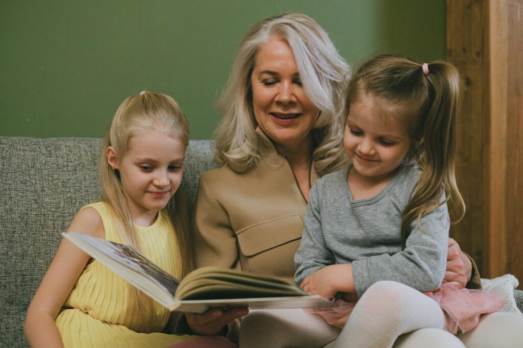 A cozy reading corner where grandparents read to their grandchildren, showcasing valuable parenting tips for grandparents …