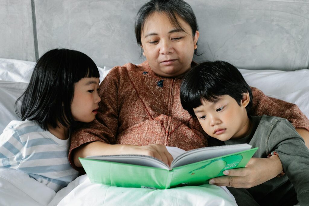 A cozy scene of a grandparent reading a book to their grandchild, fostering connection. — grandparents help grandchildre…