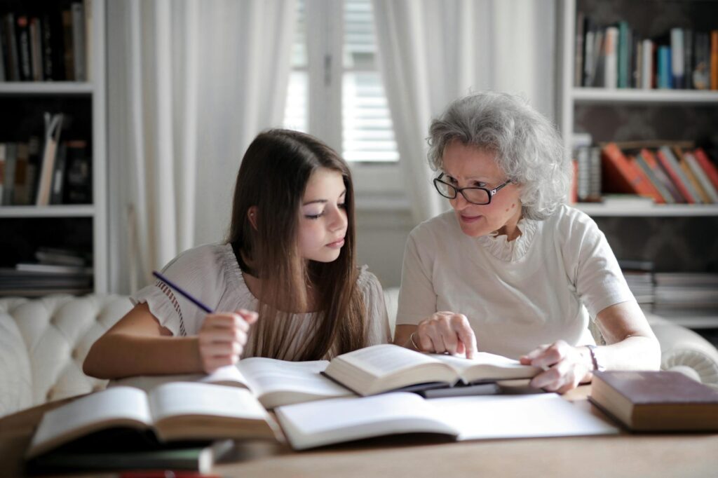A friendly grandparent discussing IEP goals with a teacher. — IEPs for grandchildren Utah