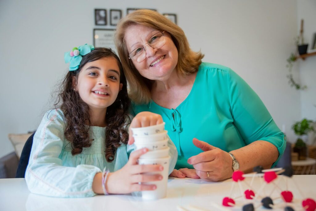 A grandparent and grandchild engaged in a fun educational activity together. — educational support grandchildren divorce