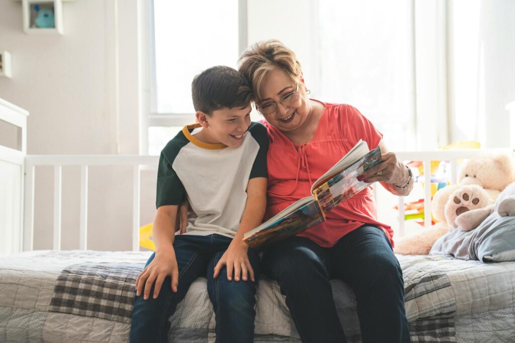 A grandparent reading a book with a child to illustrate engagement in learning. — grandfamilies academic success Utah