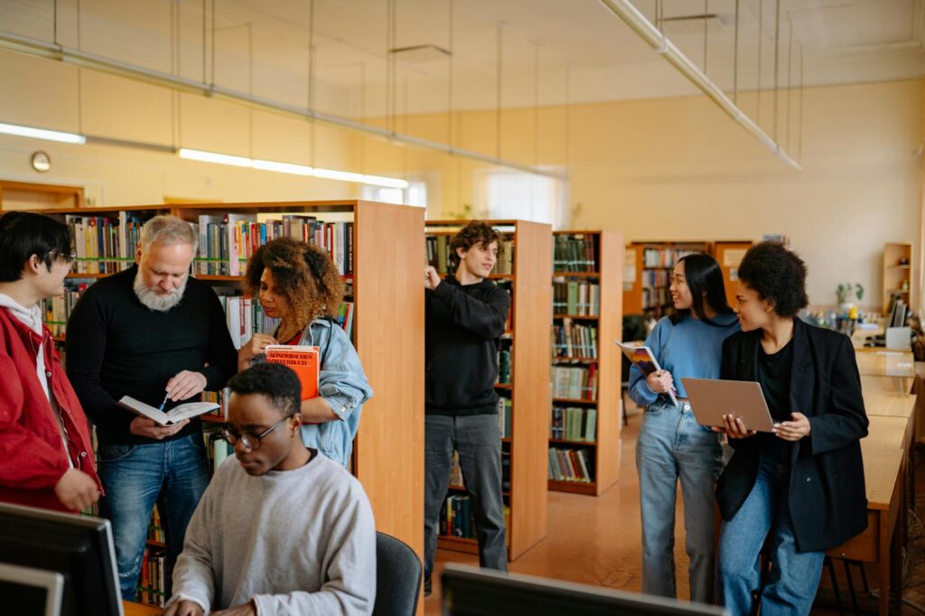 A group of grandparents discussing educational resources at a community center — help grandchildren succeed school Utah