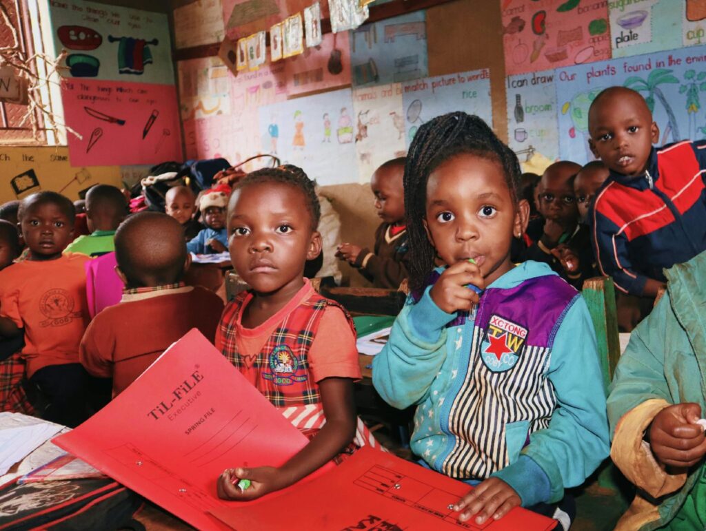 A group of grandparents engaging with children in a classroom setting, showcasing the community spirit. — volunteer oppo…
