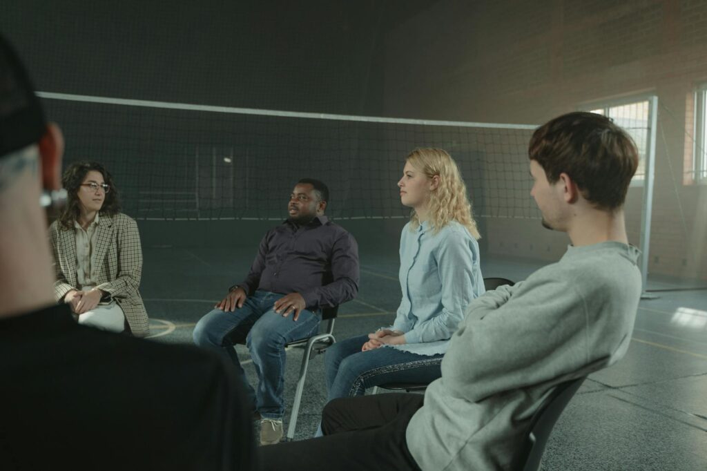 A group of grandparents sharing experiences in a support group setting — legal aid grandparents raising grandchildren Utah