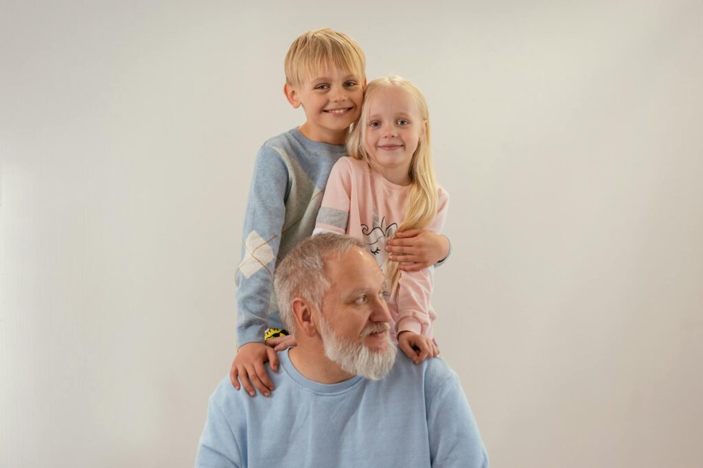 A happy family portrait of a grandparent and grandchildren in Utah. — Grand Families Utah
