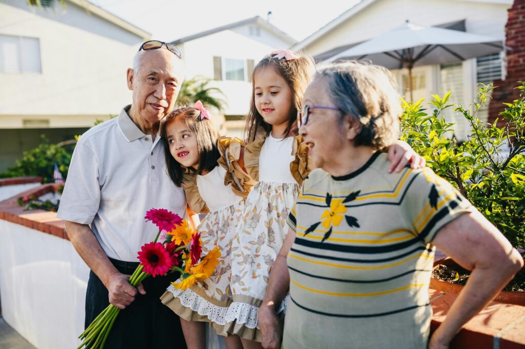 A happy family portrait of grandparents with their grandchildren, showcasing the importance of financial planning for gran…