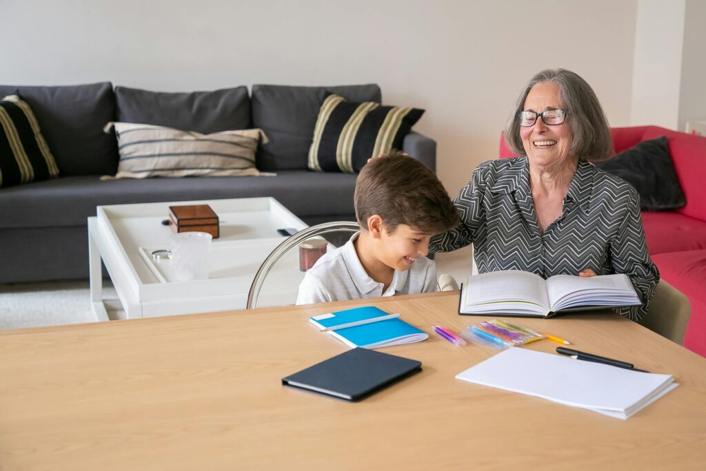 A happy grandparent reading with their grandchild, symbolizing family support. — grandparents legal rights Utah
