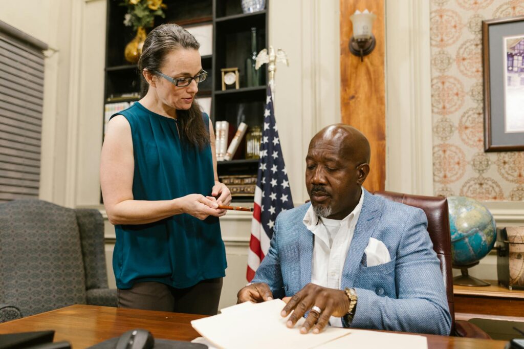 An illustration depicting a grandparent discussing legal options with a lawyer. — legal aid programs grandparents Utah