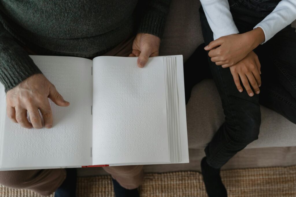 An image of a grandparent and child reading together, symbolizing the bond and support of grandfamilies, highlighting financial assistance grandfamilies Utah.