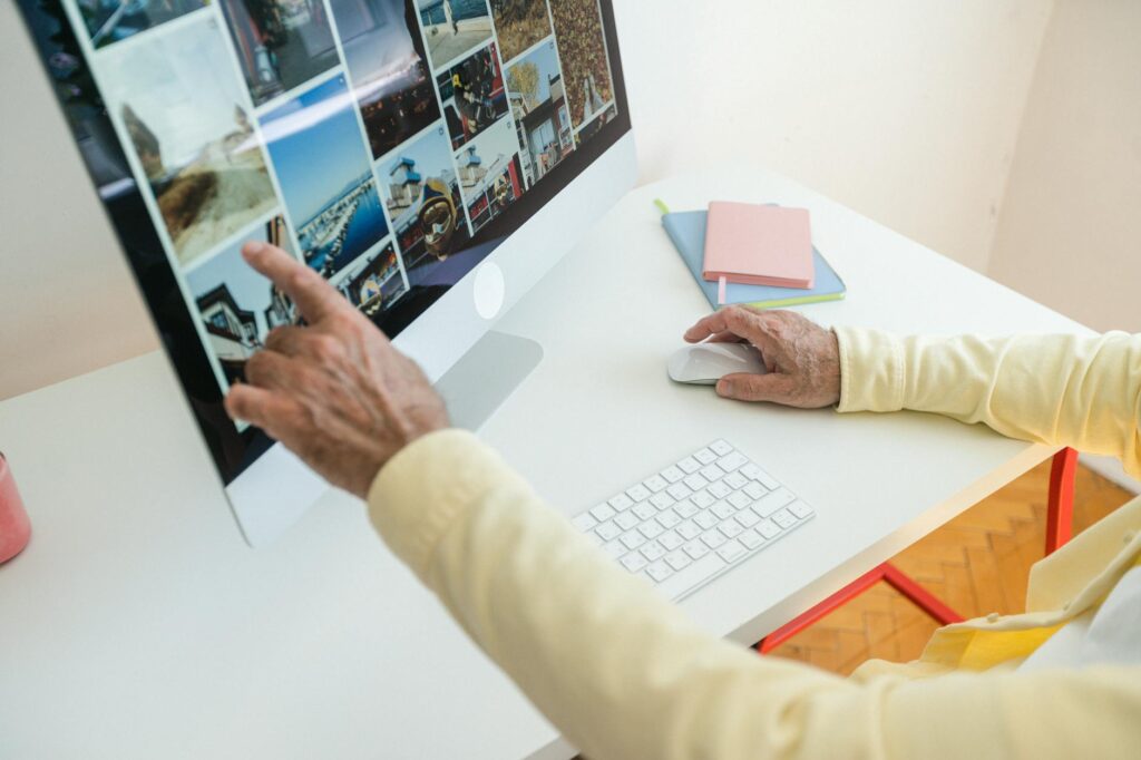 An image of grandparents working on a computer to apply for scholarships. — financial aid grandfamilies Utah