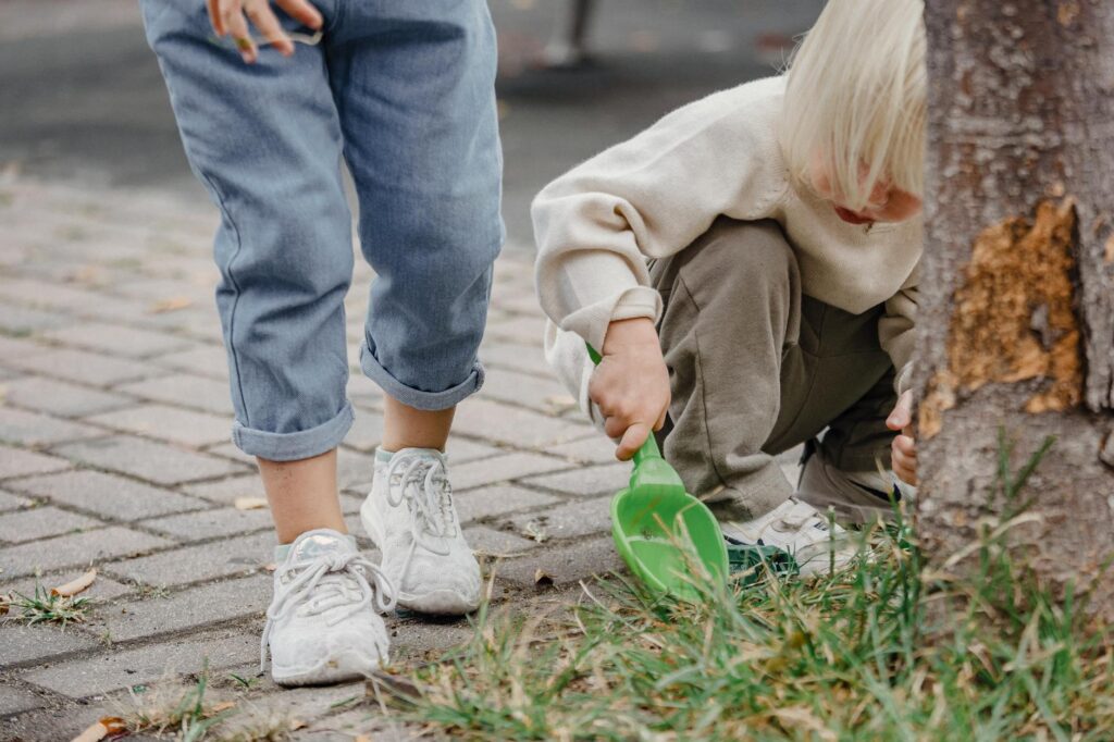 Children playing in a safe environment, symbolizing kinship care. — grand families Utah