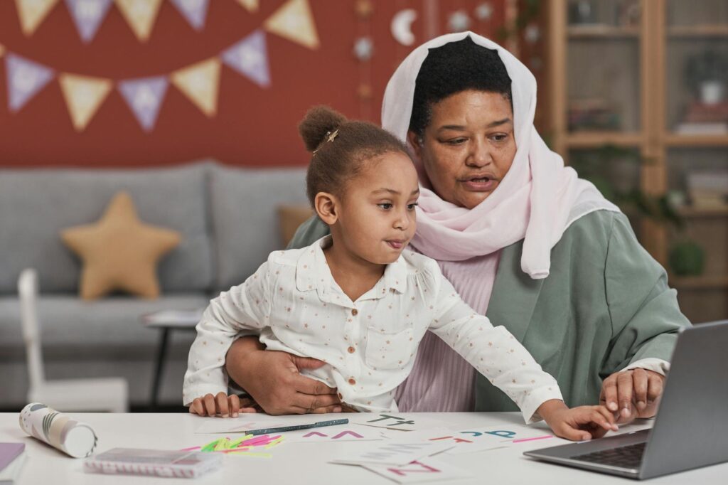 Image of a group of grandfamilies utilizing online resources for learning together. — technology support grandfamilies e…