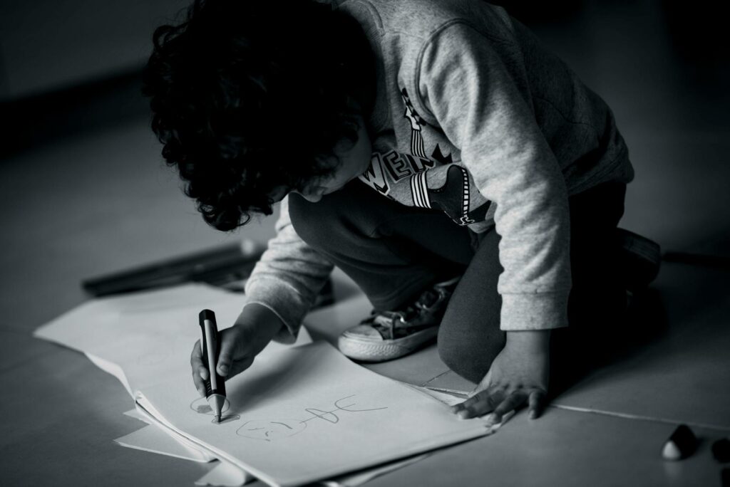 a child drawing or writing to express their feelings about divorce — open dialogue grandchildren divorce