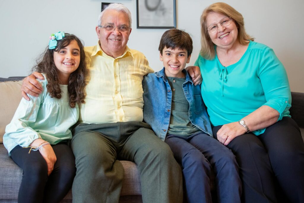image of grandparents and grandchildren smiling during a family gathering — mediation grandparents Utah