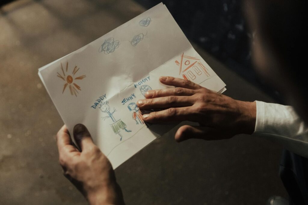 A close-up of a child's drawing depicting their feelings, highlighting the importance of emotional expression. — trauma …