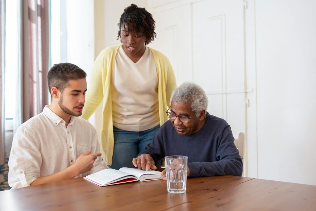 A family receiving assistance at a community center, representing financial help for grandfamilies. — Grandfamilies reso…