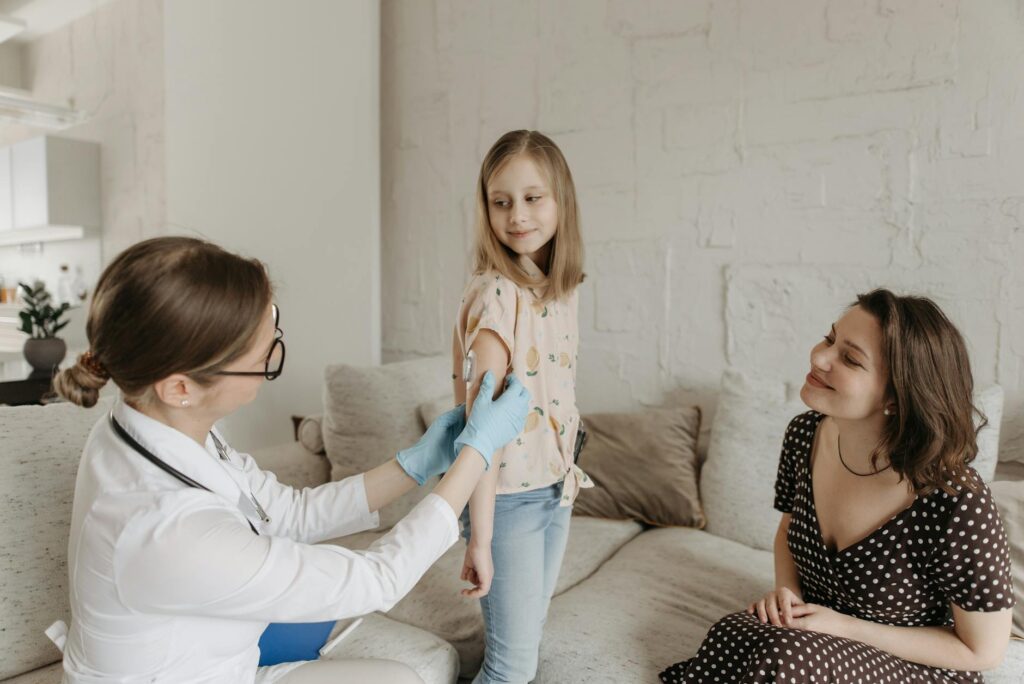 A happy family visiting a local healthcare provider for preventive care. — health insurance grandparents Utah