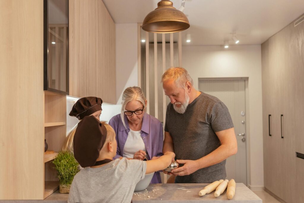A heartwarming image of a grandfamily cooking together at home. — financial aid for grandfamilies Utah