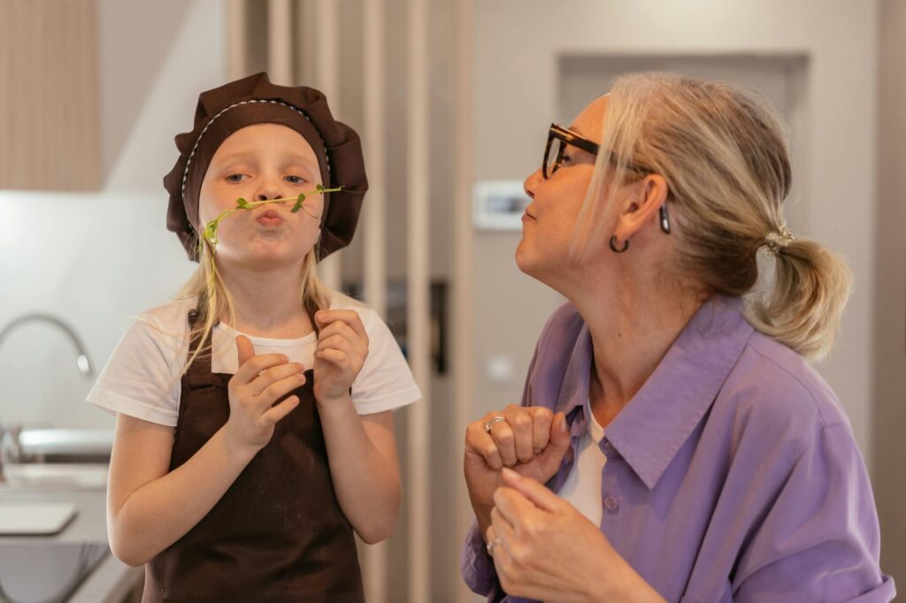 A smiling grandparent and grandchild engaging in a fun activity together. — financial assistance grand families Utah